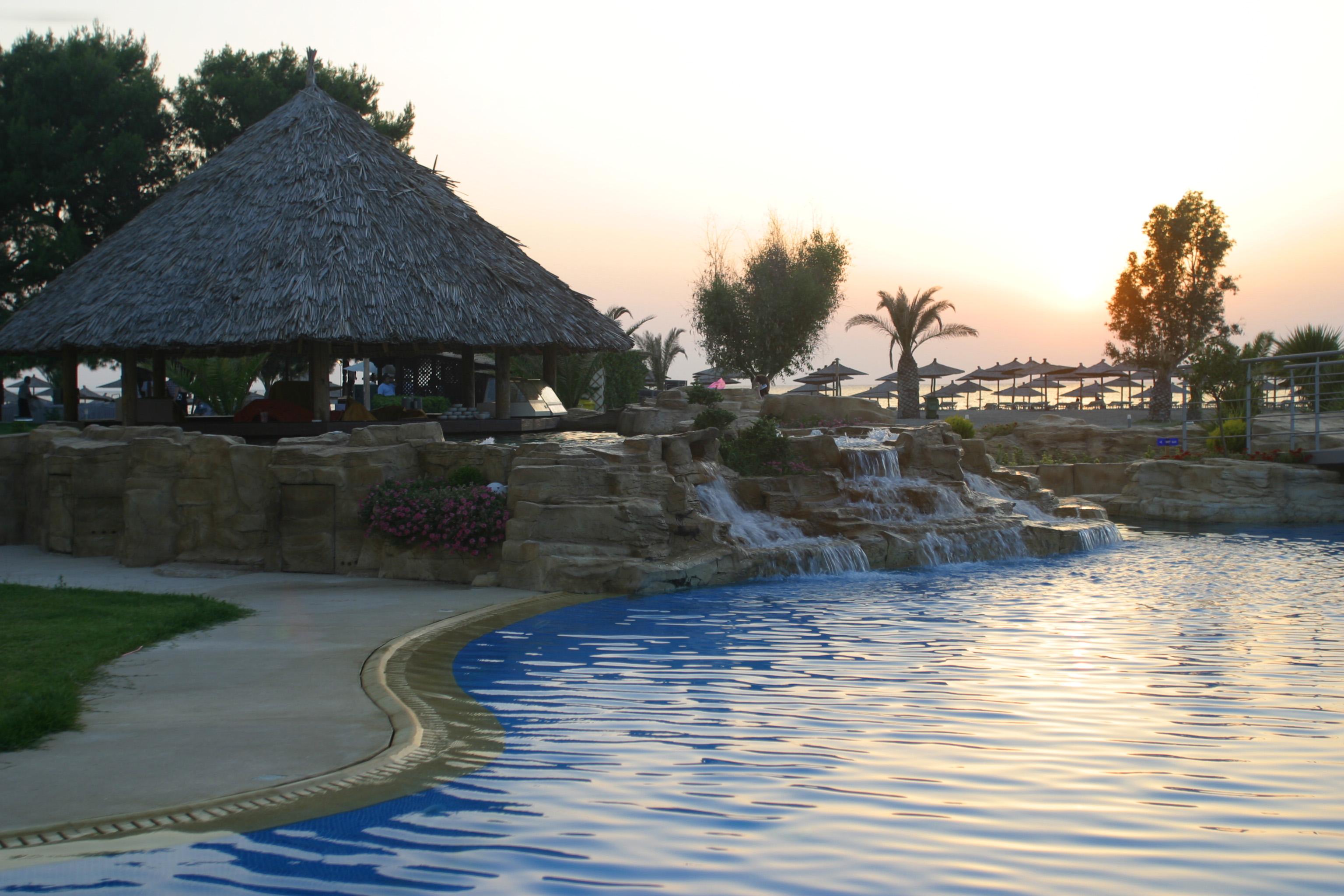Porto Carras Meliton Hotel Neos Marmaras Exterior photo Sunset at the pool