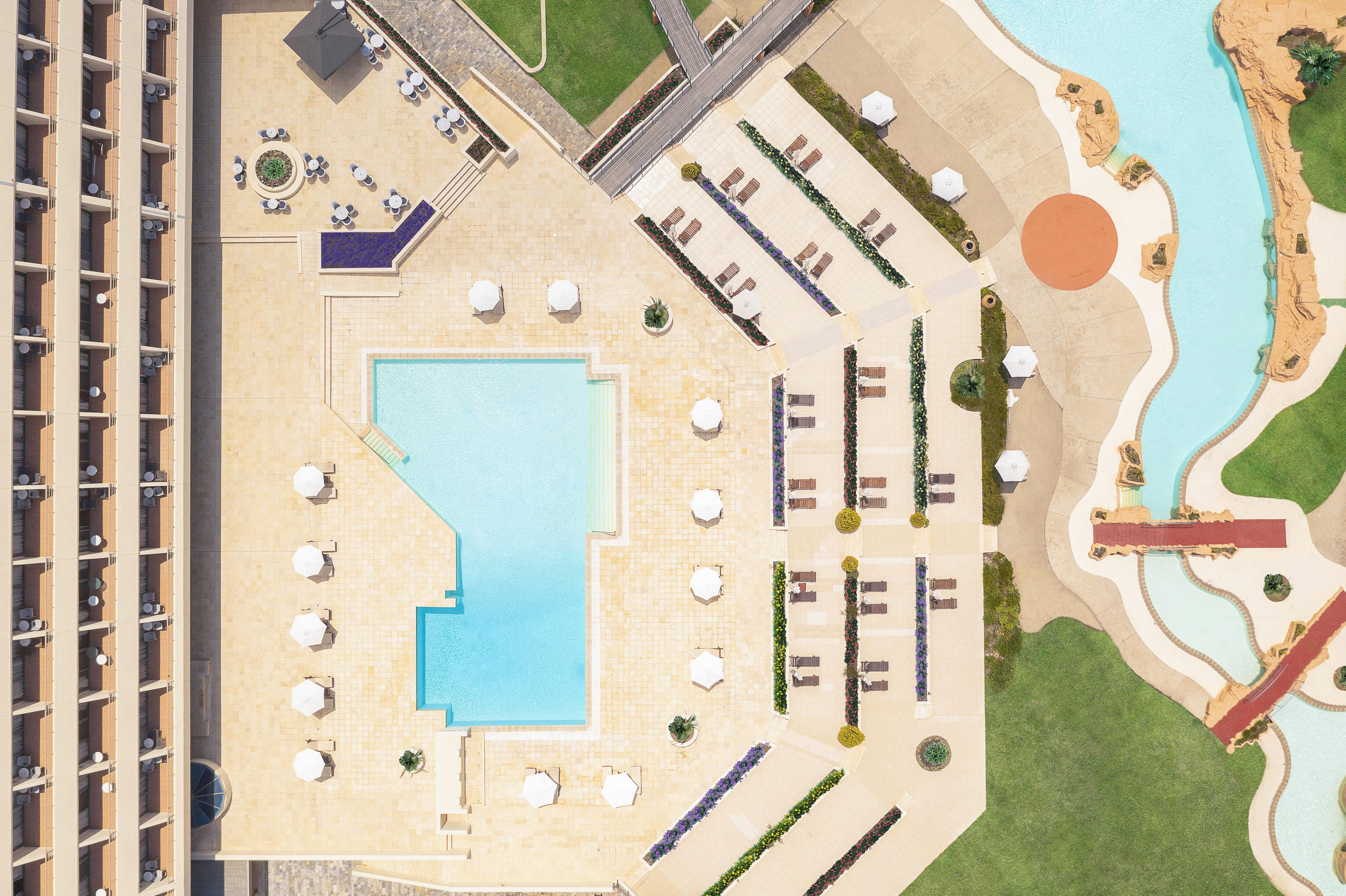 Porto Carras Meliton Hotel Neos Marmaras Exterior photo Aerial view of the pool at the Hotel