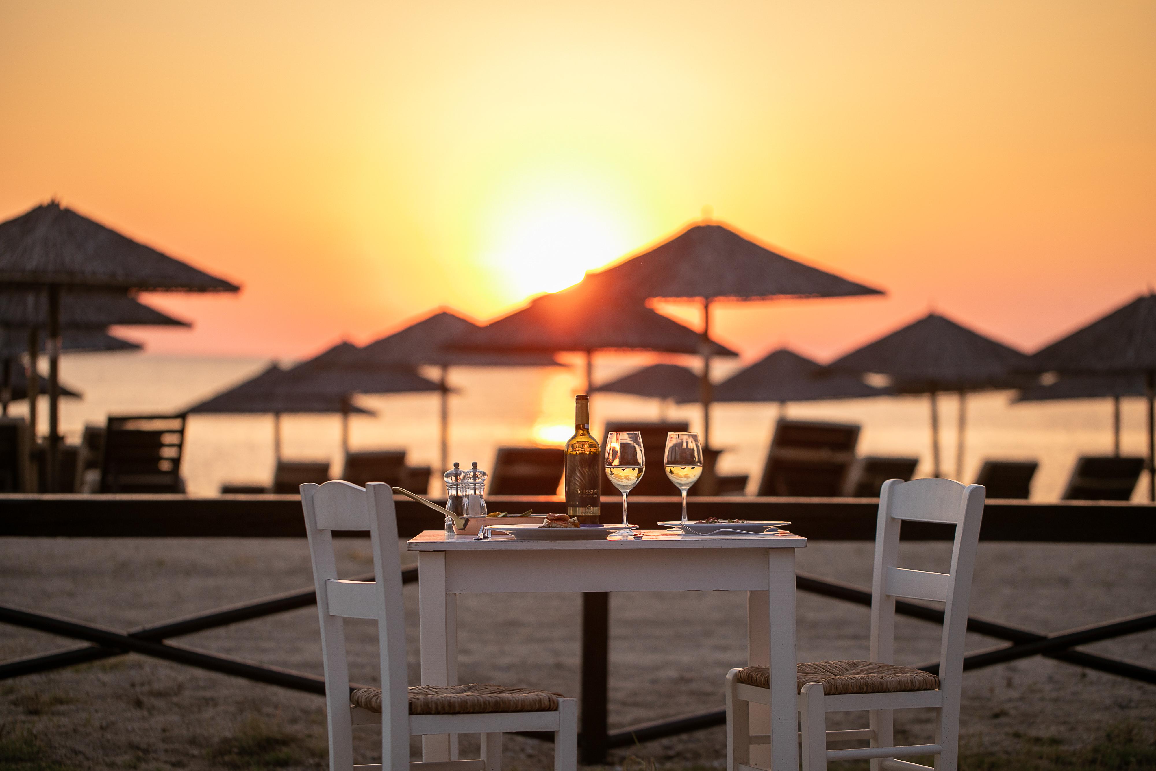 Porto Carras Meliton Hotel Neos Marmaras Exterior photo Sunset at the beach