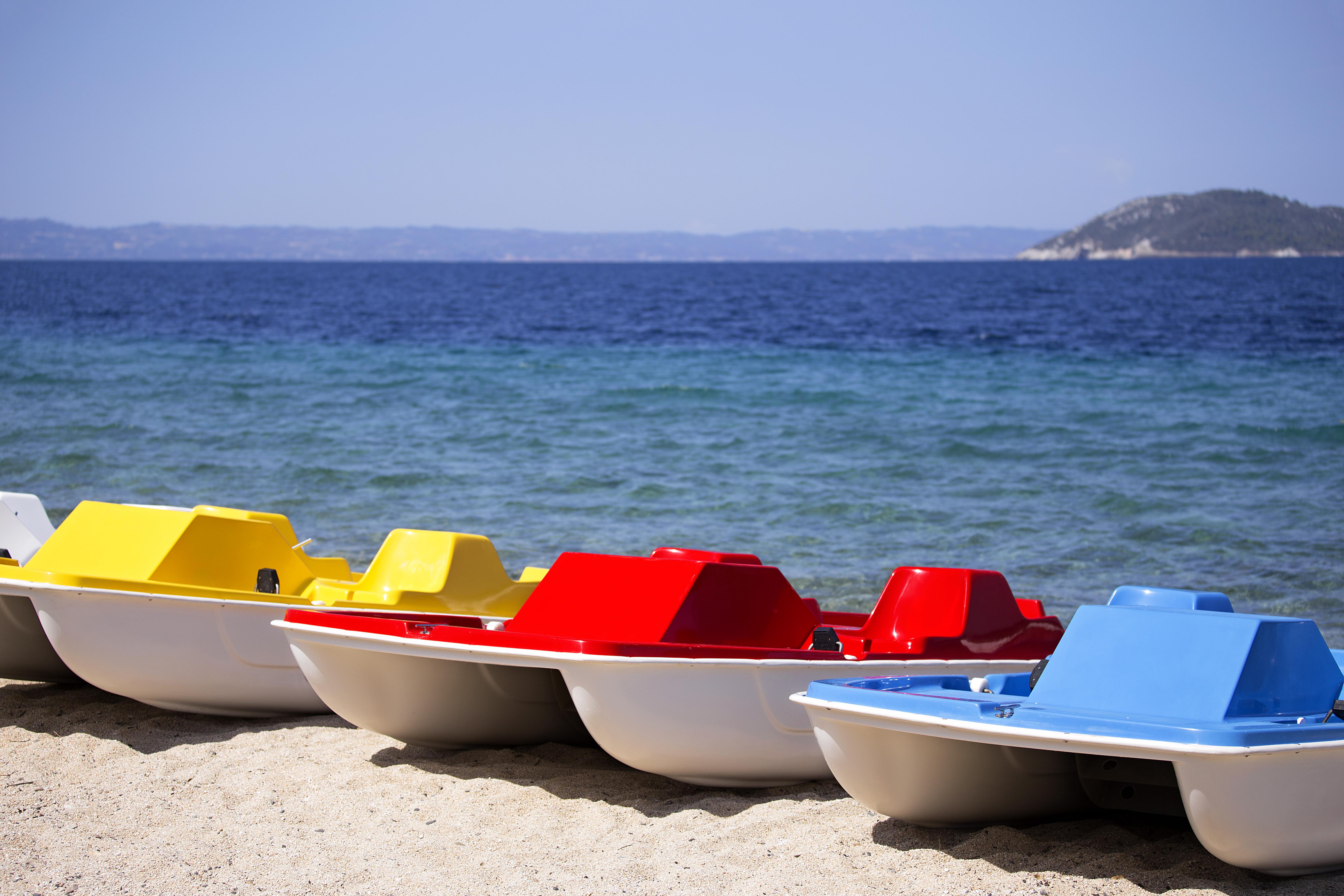 Porto Carras Meliton Hotel Neos Marmaras Exterior photo Pedal boats on a beach